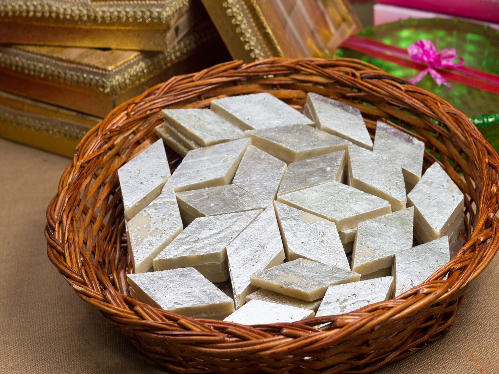 Basket of fresh kaju katli and festive gift boxes at Bhardwaj Sweets, Janakpuri Delhi